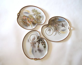 Set of three Japanese hand painted porcelain luncheon plates