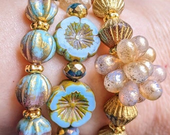 Stretch Bracelet Stack, Czech Glass Blue Gold Melon w/Tassel Charm, White Matte English Cut w/Blue Flowers, Orange Gold Bicones Drop Cluster