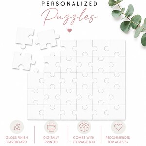 May include: A white jigsaw puzzle with a blank surface, featuring three detached pieces at the top left. The text "PERSONALIZED Puzzles" appears at the top, with icons below indicating a gloss finish, digital printing, and a storage box.