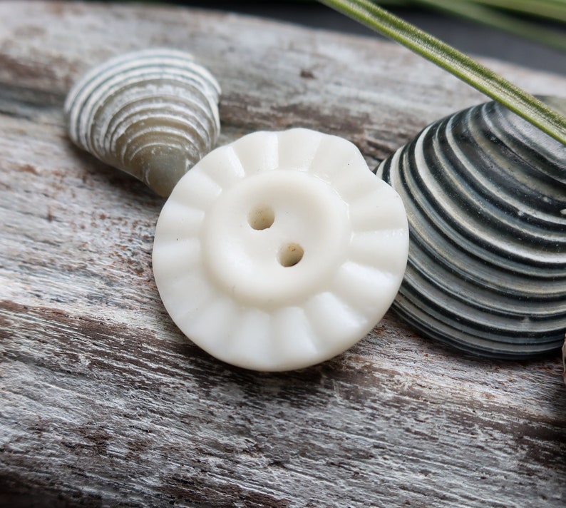 found on the west coast of scotland White milk sea glass button vintage button