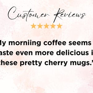 May include: A customer review graphic featuring the text Customer Reviews above five yellow stars and the quote: My morniing coffee seems to taste even more delicious in these pretty cherry mugs. The background is a soft, pale pink watercolour texture.