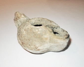 古代ローマのテラコッタオイルランプ：成形された浅浮き彫りのデザイン