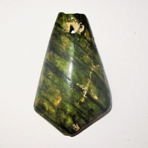 May include: A set of three ceramic mugs with a speckled, matte finish. The mugs are in shades of cream, light gray, and dark gray. Each mug has a simple, minimalist design and a rounded handle.