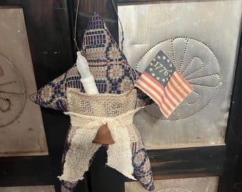 9-1/2” x 13” coverlet primitive star with timer taper. Americana