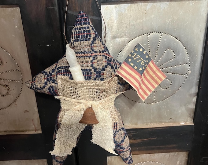 9-1/2” x 13” coverlet primitive star with timer taper. Americana
