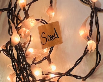 hand dipped teeny silicone rice light electric “sand”