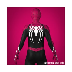 May include: A black and pink Spiderman costume with a white spider logo on the back. The costume is shown from the back.