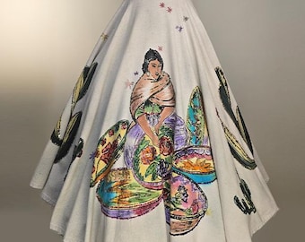 May include: A vintage, off-white skirt featuring a hand-painted design. The skirt showcases a seated figure surrounded by colorful bowls and floral patterns. Black cactus and star accents are also present, creating a unique, artistic look.