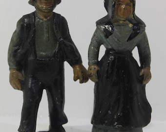 Vintage cast iron Amish man and woman