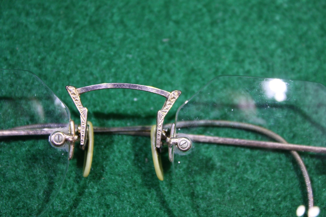 Vintage Gold Rimless Saddle Bridge Eyeglasses With Original Etsy vintage-gold-rimless-saddle-bridge-eyeglasses-with-original-etsy