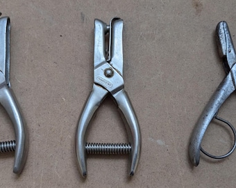 Three hand held hole punches -(2) Sargent and (1) umarked.