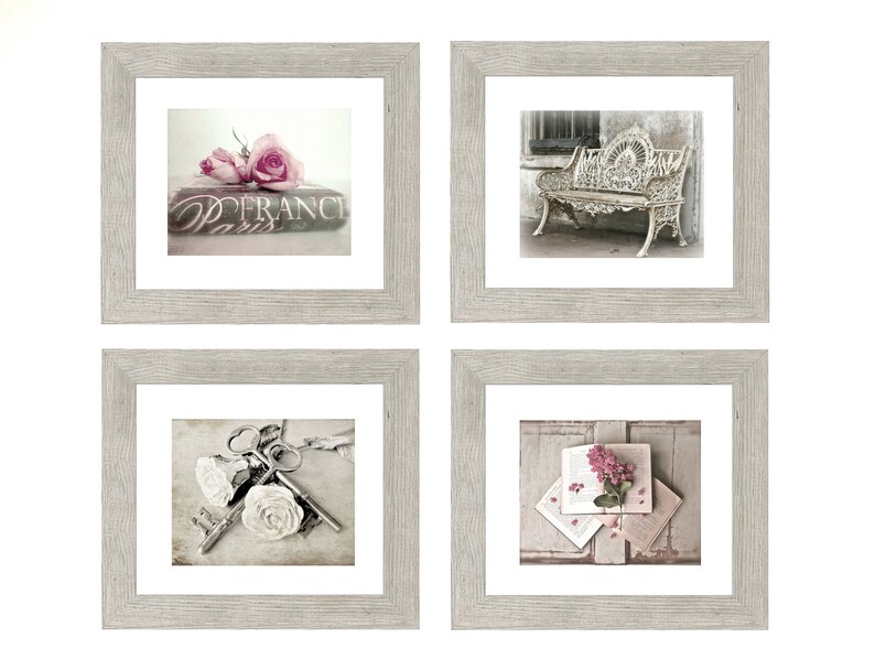 May include: Set of four framed prints with a vintage aesthetic. The prints feature a book with roses, a wrought iron bench, keys with roses, and a book with a pink flower.