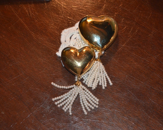 A Pair of HEARTS with PEARLS by Estee Lauder - A matching set for powdering her pretty nose and renewing her favorite scent.