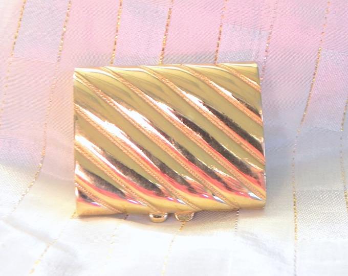 Estee Lauder Golden Wave (1980) or Golden Ribbon (1986)