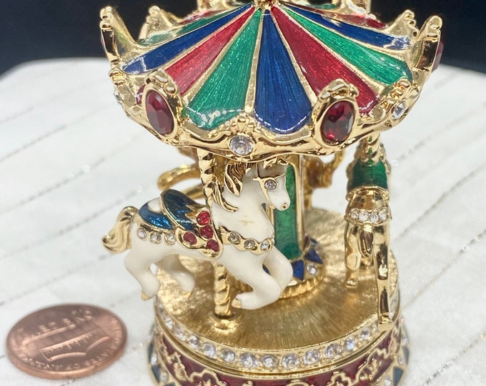 Estée Lauder solid perfume CAROUSEL with tiny horse, deer and lion.  An intricate piece of art with the side benefit of Pleasures.
