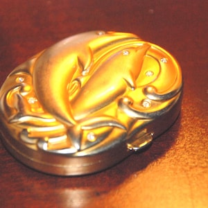 RARE GOLDEN DOLPHINS Powder Compact with Transparent Estee Lauder Lucidity circa 1998