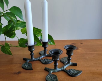 A pair of verdigris brass candlestick holders, leaf motif:  nature inspired 1990s decor, dark green taper candle holders