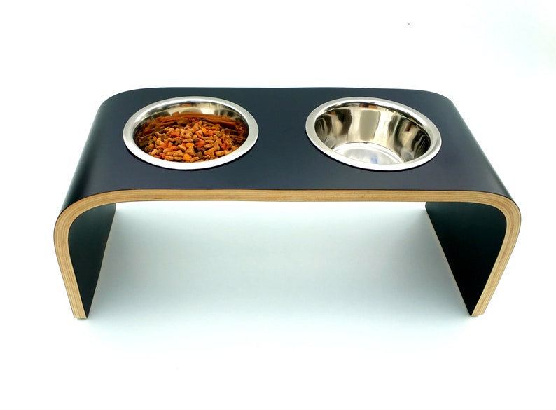 Top and front view of Black shell  ( matt finish ) double raised dog feeder with stainless steel bowls and natural wood edge finish.