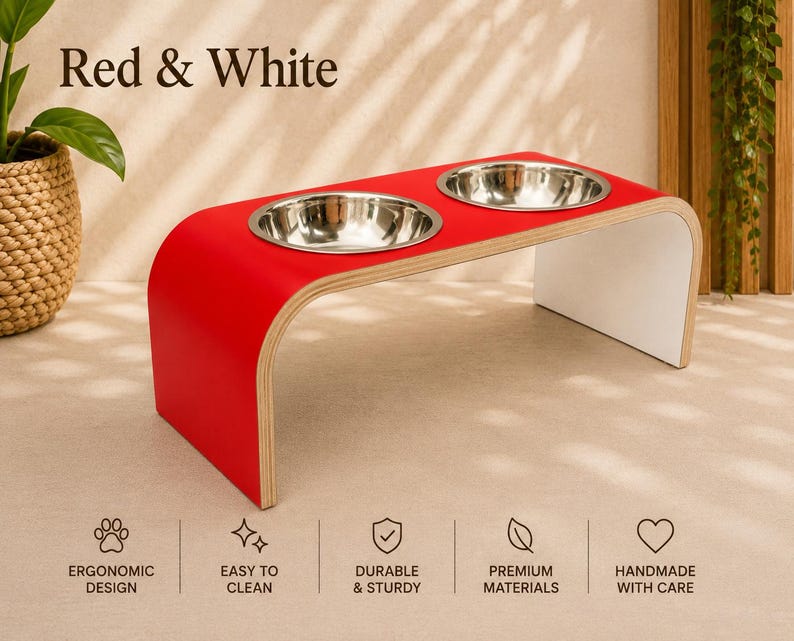 Red and white raised dog bowl stand with stainless steel bowls, handmade elevated wooden pet feeder in a modern home, stylish feeding station for dogs and cats.