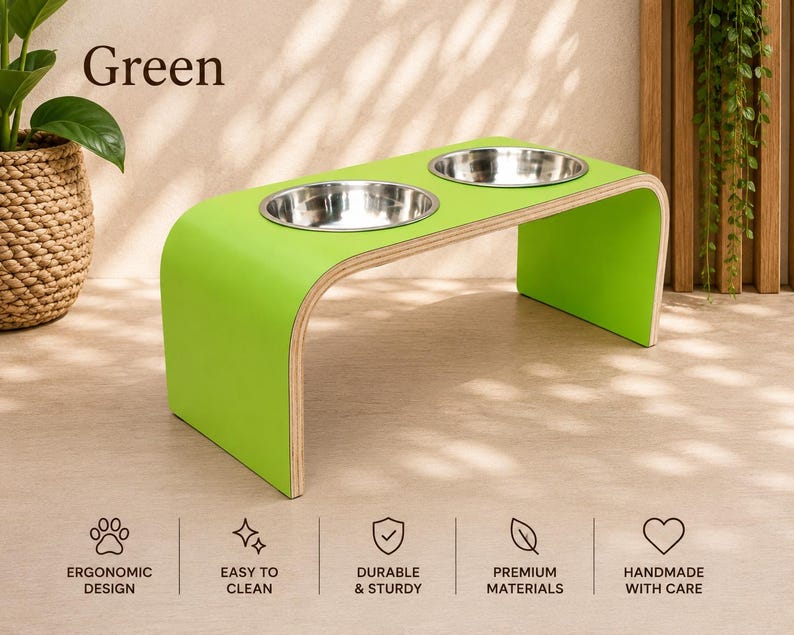 Green raised wooden dog bowl stand with stainless steel bowls, handmade elevated pet feeder in a modern interior, stylish feeding station for dogs and cats.