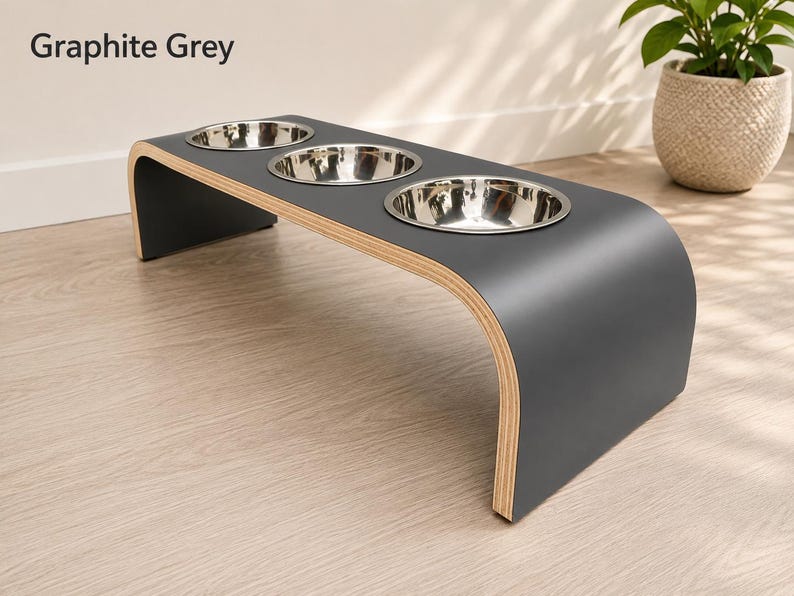 Modern graphite grey raised triple dog bowl stand with stainless steel bowls, handcrafted curved wooden pet feeder for dogs and cats.