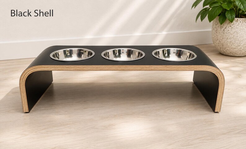 Modern black shell raised triple dog bowl stand with stainless steel bowls, handcrafted curved wooden pet feeder for dogs and cats.