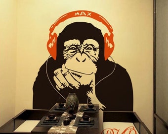 バンクシースタイルの音楽猿のウォールアート、ヘッドフォンで