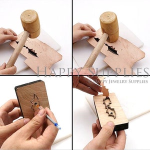 May include: A leather craft tool for cutting out shapes. The tool is made of wood and has a metal blade. The tool is being used to cut out a bat shape from a piece of leather. The leather is being held in place by a wooden block. A hammer is used to press the tool into the leather.