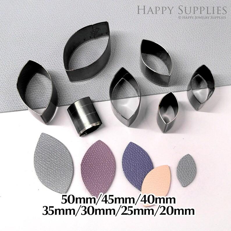 May include: Set of 7 metal leaf-shaped leather craft punches in various sizes: 50mm, 45mm, 40mm, 35mm, 30mm, 25mm, and 20mm. The punches are arranged on a gray surface with leather samples cut out using the punches.