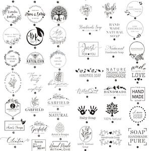 May include: A collection of 40 different black and white logo designs for handmade soap. The logos feature various designs, including floral wreaths, hearts, trees, and handwritten text. The logos are arranged in a grid pattern on a white background.