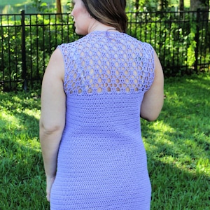 May include: A lavender crochet dress with a lacy back and sleeveless design.
