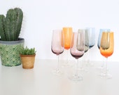 Lot of 7 champagne flutes in colored and engraved glass