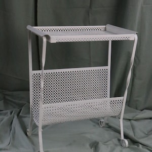 Magazine rack, attributed to Mathieu Matégot
