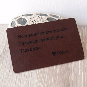 May include: A brown leather wallet with the text "No matter where you are, I'll always be with you. I love you. Glenn" engraved on it.