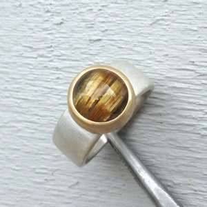 Rutilated quartz ring in 750 gold and silver