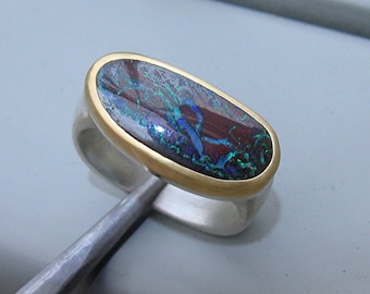 Ring mit Boulderopal in Gold und Silber