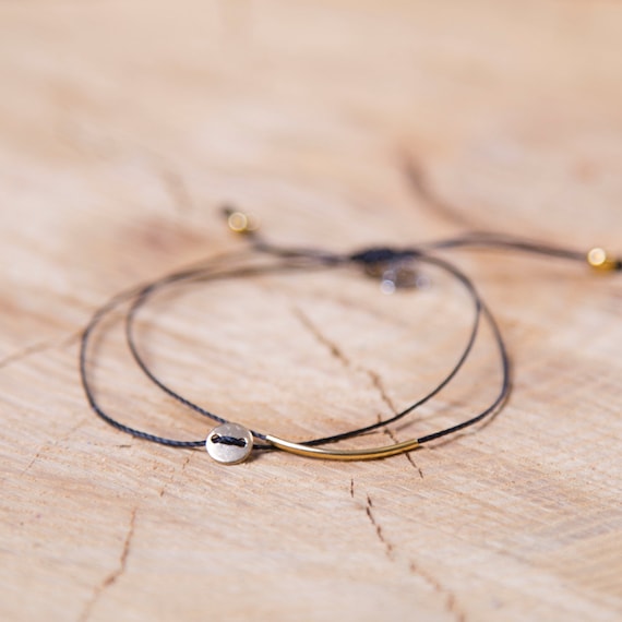 Delicate gold-plated bracelet on a nylon thread handmade in Montreal