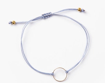 Delicate ring bracelet on a blue thread handmade in Montreal