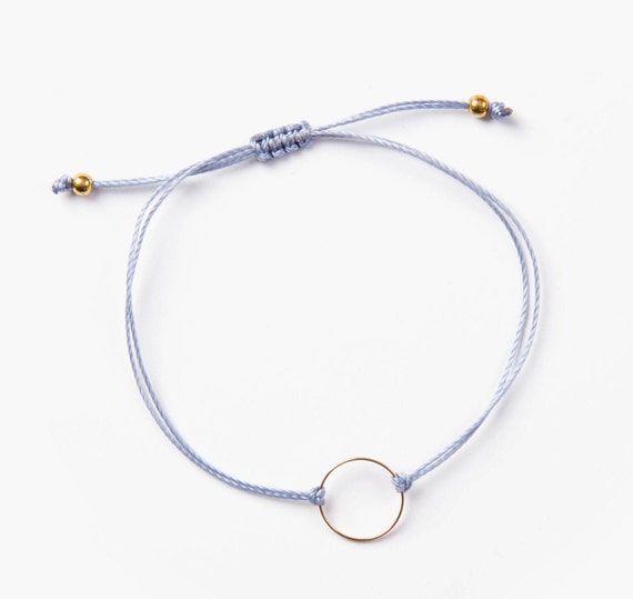 Delicate ring bracelet on a blue thread handmade in Montreal