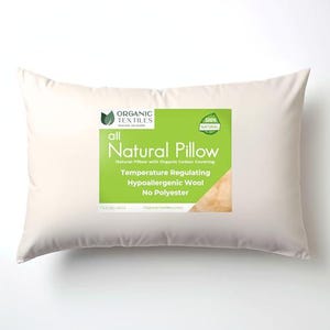 May include: A white pillow with a green and white label that reads "all Natural Pillow" with the text "Natural Pillow with Organic Cotton Covering, Temperature Regulating, Hypoallergenic Wool, No Polyester".