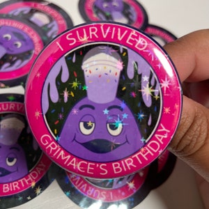 May include: A circular badge with a pink rim, displaying the text "I SURVIVED GRIMACE'S BIRTHDAY". The design includes a purple character with a milkshake. The background is black with colourful starbursts and sprinkles.