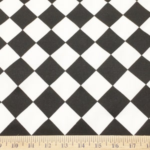 May include: Black and white checkered fabric with a ruler measuring 19 inches.
