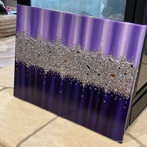 May include: Purple and silver abstract painting with a textured silver glitter design. The painting has a vertical stripe pattern.