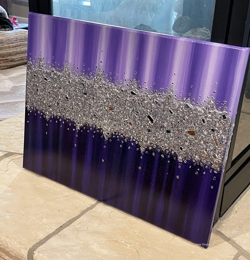 May include: Purple and silver abstract painting with a textured silver glitter design. The painting has a vertical stripe pattern.