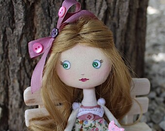 Cloth doll, vintage mother-of-pearl girl and her pink cat