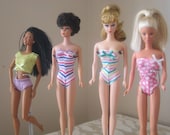 Barbie swimsuit reproductions similar to the original black and white Barbie suit, and the Midge two-piece suit.
