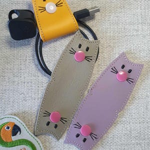 NF キャットコードラップ 4 x 4 および 5 x 7 マルチ ITH デジタルファイル（刺繍機専用）