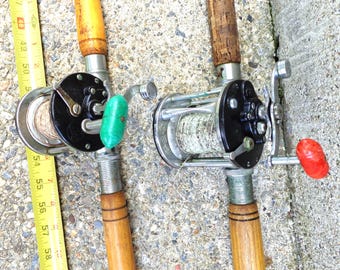 Vintage Penn Reels with Salt Water Fishing wood and fiberglass Rods No. 350 and 160