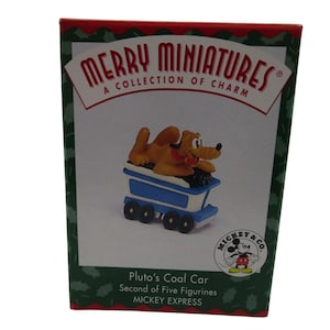 May include: A red box with a green border featuring a cartoon image of Pluto the dog in a blue coal car. The box reads "Merry Miniatures, A Collection of Charm" and "Mickey & Co.". The text on the box also reads "Pluto's Coal Car, Second of Five Figurines, Mickey Express."