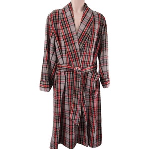 May include: A long-sleeved robe with a plaid pattern in shades of red, black, and gray. The robe has a self-tie belt and two pockets.